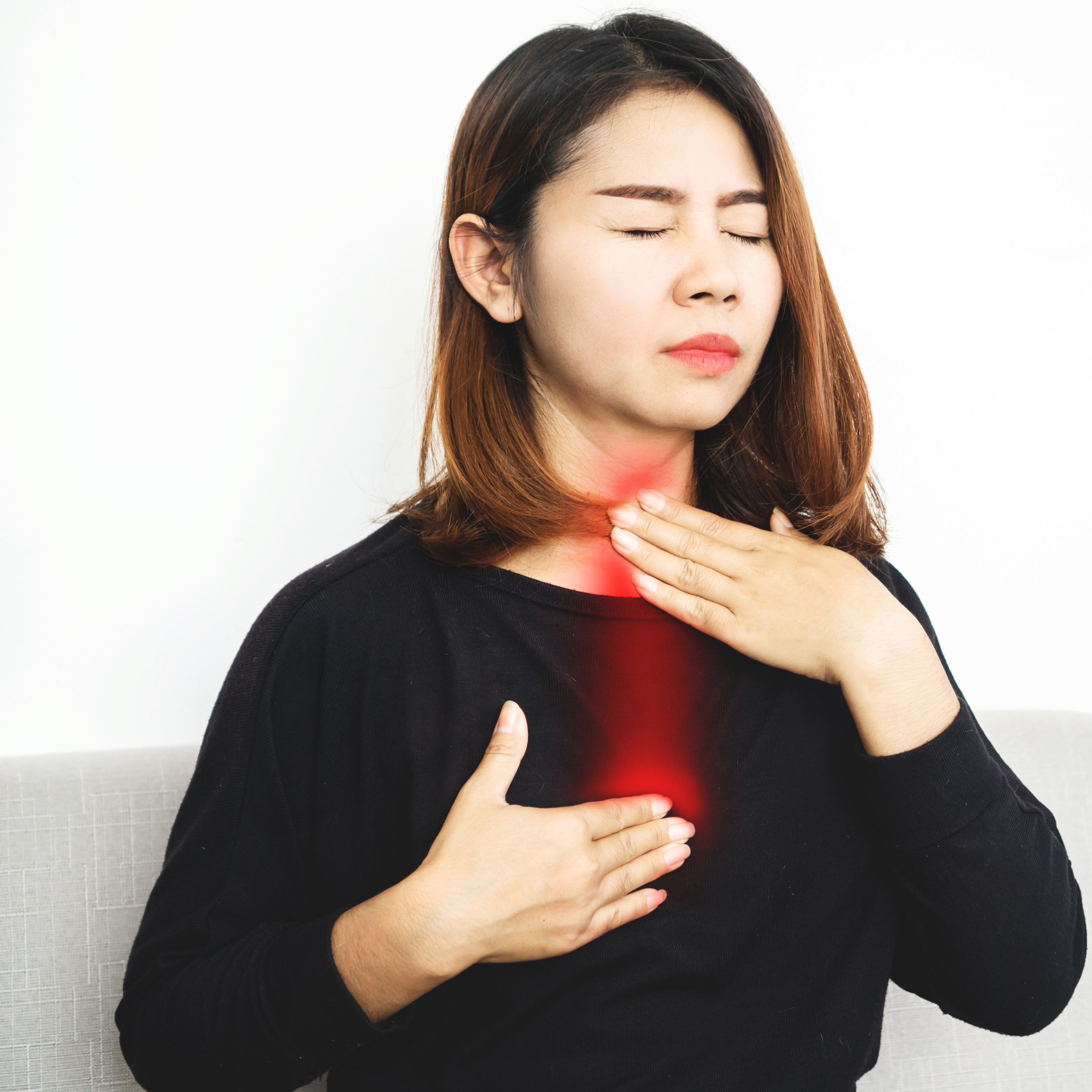 Cream and White Minimalist Bones Medical Instagram Post (6) A woman holding a spoonful of spicy food with rice while clutching her stomach in discomfort, indicating digestive issues. The image represents the impact of diet on gut health. Dheemahi Ayurveda logo is visible, suggesting an Ayurvedic approach to digestive wellness.