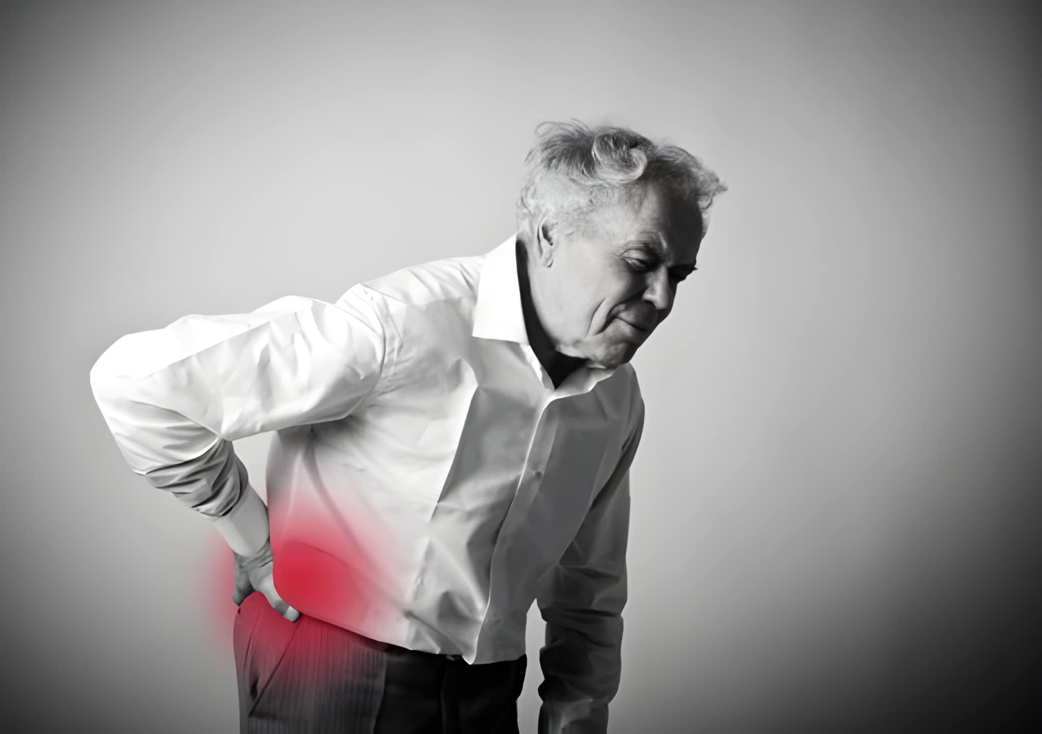 Psoriatic arthritis back pain causing stiffness and inflammation in the lower spine of an elderly man