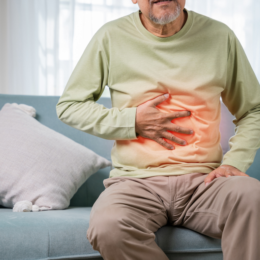 Ayurvedic Gastric Treatment for Stomach Pain Relief Elderly man experiencing stomach pain representing ayurvedic gastric treatment for digestive relief