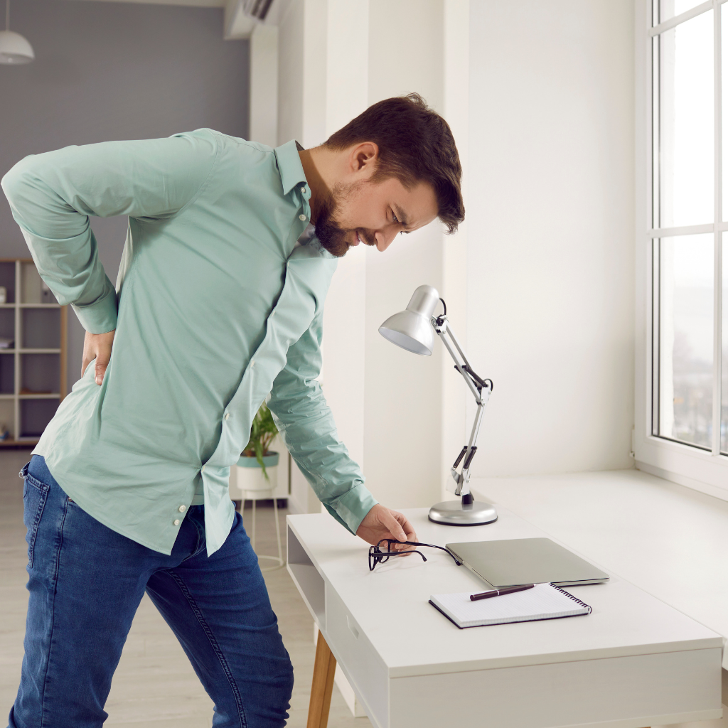 Lower Back Pain During Pregnancy – Causes and Relief Pregnant woman holding her lower back in discomfort representing lower back pain during pregnancy