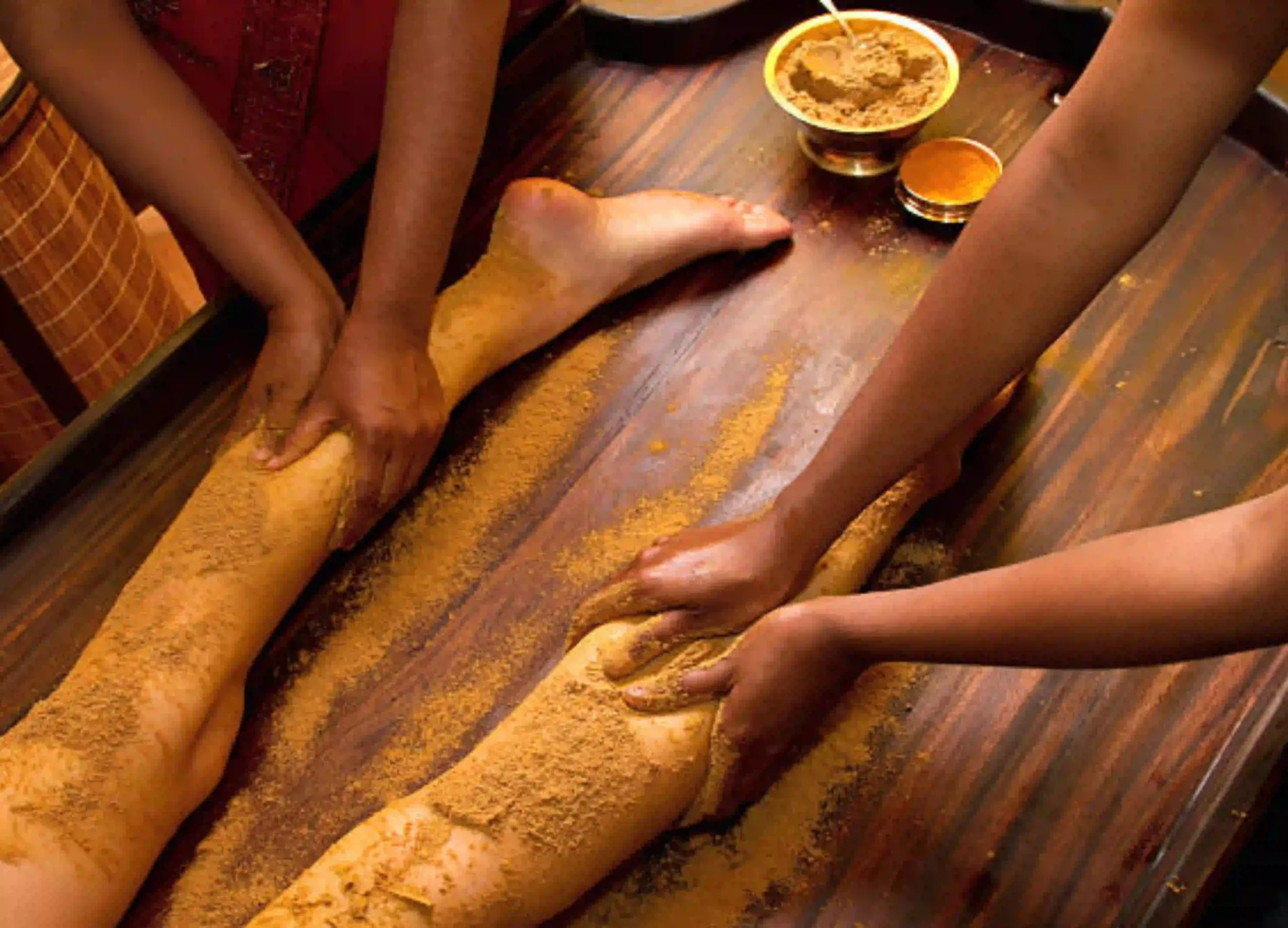 Karkidaka Chikitsa Package featuring traditional Ayurvedic herbal powder therapy for the legs