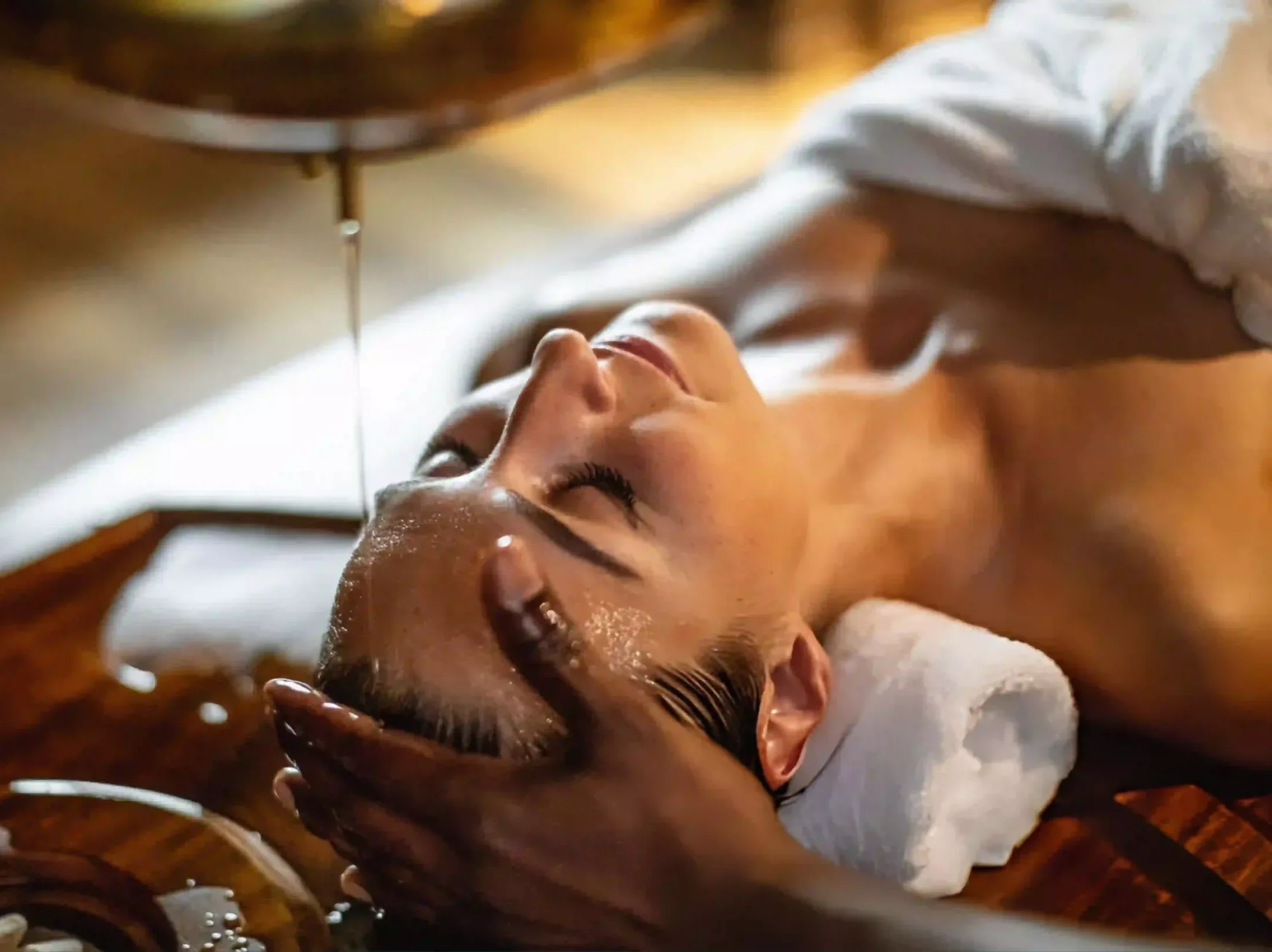 Woman receiving Shirodhara Ayurveda treatment for menopause to help manage hot flashes, stress, hormonal imbalance, and improve overall well-being.